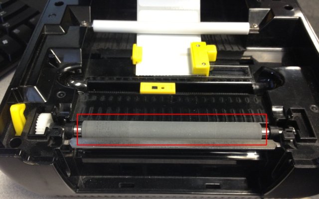 A platen roller on a desktop thermal printer